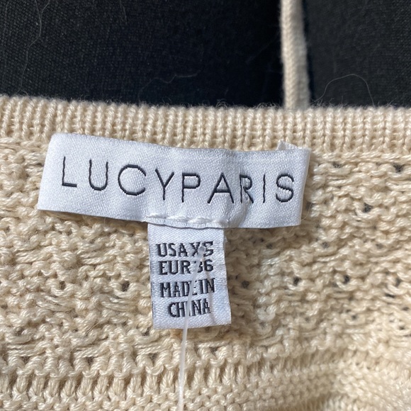 This is a very soft sweater the material is soft. It is beige size x small - Picture 4 of 5